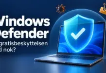 Windows Defender – er den innebygde gratisbeskyttelsen god nok? En bærbar PC med et blått beskyttelsesskjold omgitt av symboler for virus og nettsvindel, med teksten «Windows Defender – Er gratisbeskyttelsen god nok?».